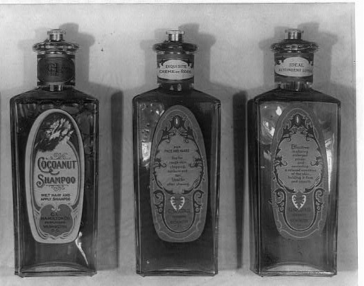 Historical photograph of three shampoo bottles.