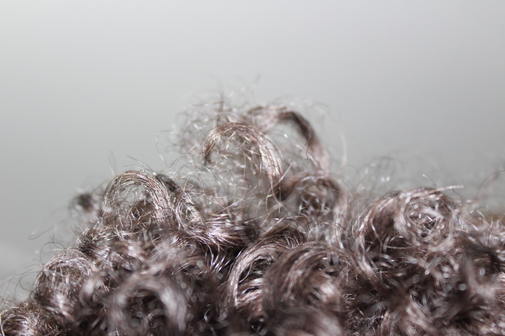 Close-up of naturally curly hair.